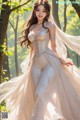 a woman in a wedding dress standing in the woods